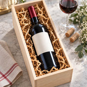 Natural brown paper shred used as packing filler in a wooden wine box next to a glass of wine - thumbnail number 11