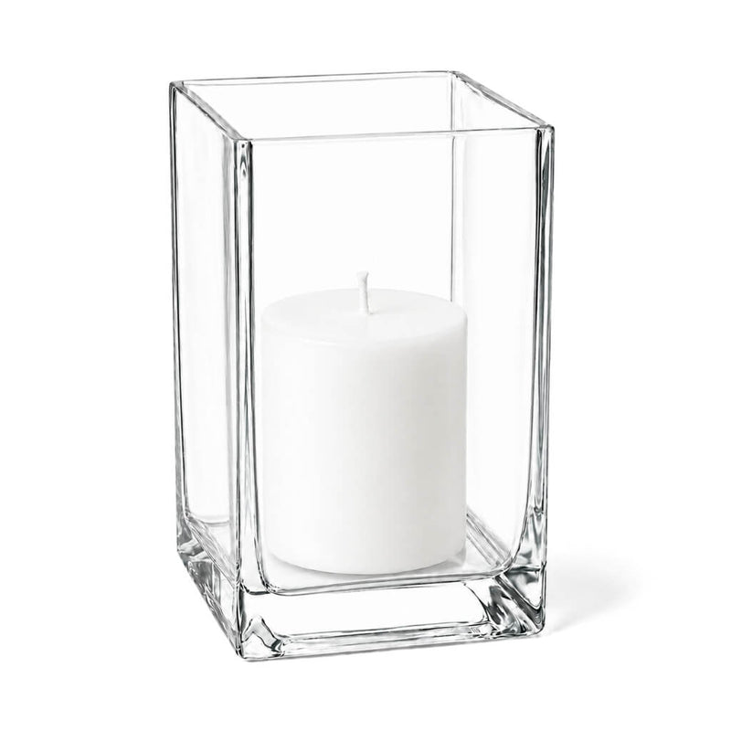 A clean product studio shot of a glass Square Pillar Candle Holder 6" with an unlit candle - thumbnail number 2