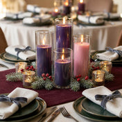 Purple and pink pillar candles in glass holders on a holiday table - thumbnail number 4