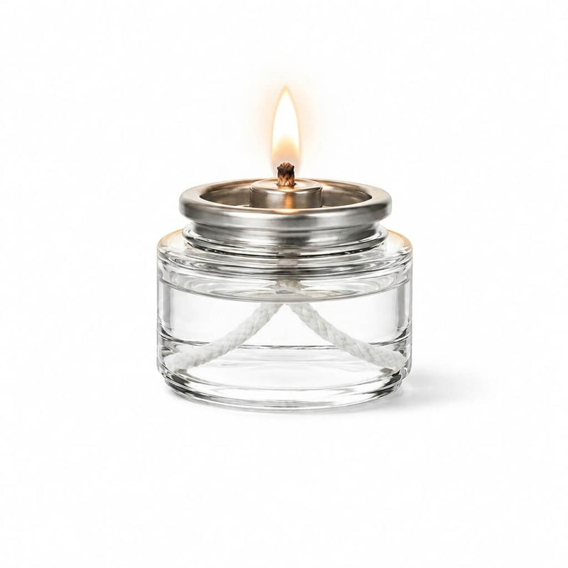 Lit Liquid Paraffin Fuel Cell in clear glass container with silver top and white wick - thumbnail number 2