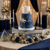 Geometric navy wedding cake on a silver mirror acrylic riser surrounded by florals - thumbnail number 4