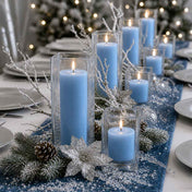 Lit light blue candle and square holder decor on a blue runner with winter elements and pinecones - thumbnail number 4