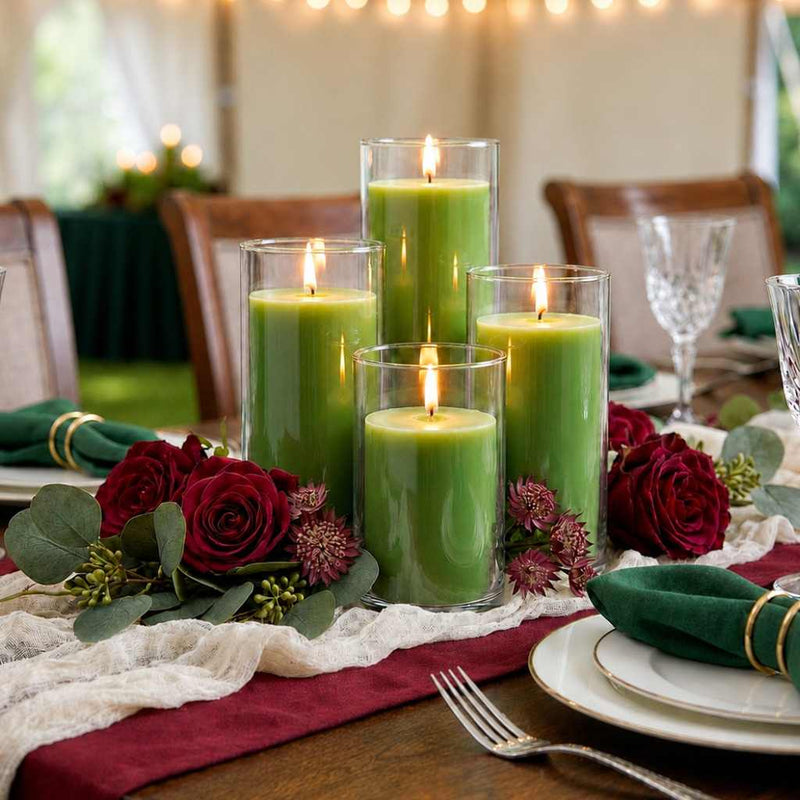 Four green pillar candles in glass cylinders on a table with red roses and greenery - thumbnail number 5