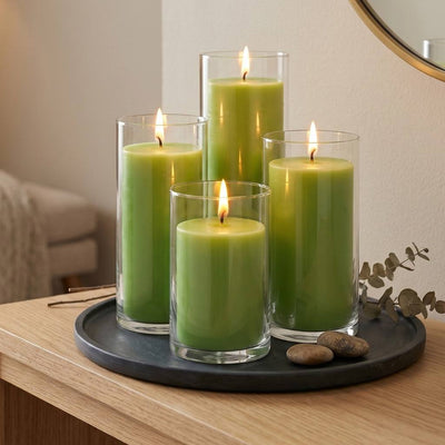 Four green pillar candles in glass cylinders on a black tray with smooth stones - thumbnail number 7