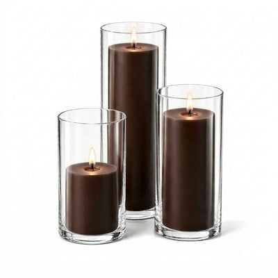 A set of three lit brown candles in glass cylinders - thumbnail number 2