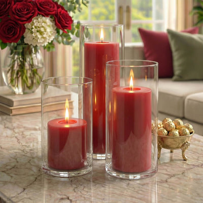 Three red pillar candles in glass holders on elegant marble coffee table - thumbnail number 7