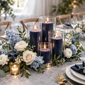 Navy pillar candles in glass vases on a romantic floral dining table - thumbnail number 3