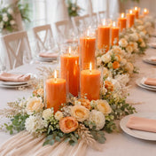 Orange pillar candles in glass cylinders with peach and white roses - thumbnail number 6