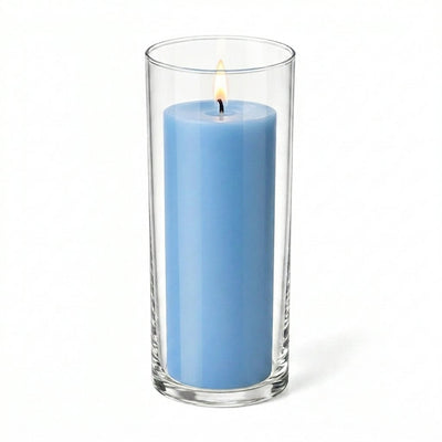 Lit light blue pillar candle inside a clear glass cylinder vase - thumbnail number 2