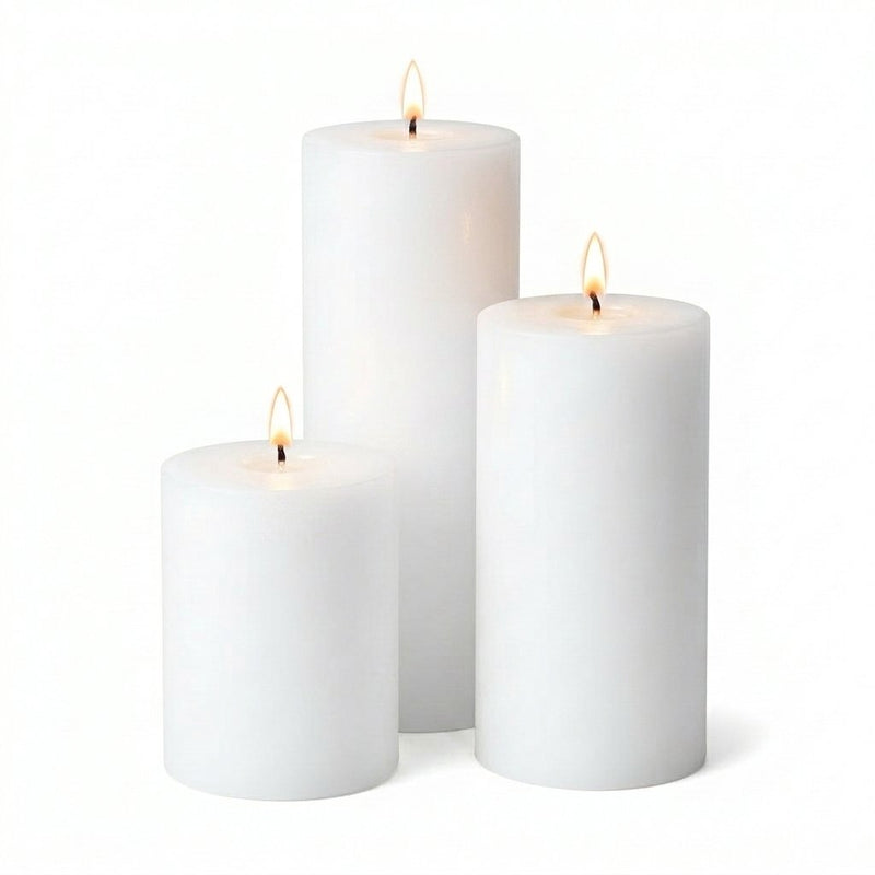 Three lit white pillar candles in assorted sizes on a white background - thumbnail number 2