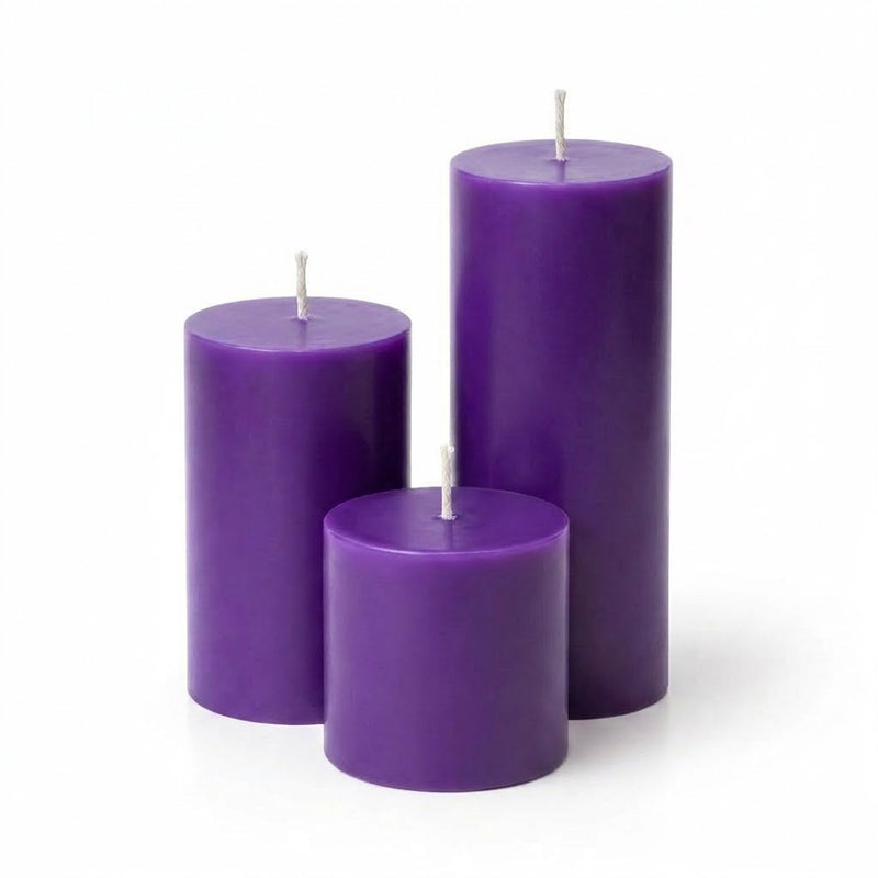 Three purple candles of different sizes on a white background - thumbnail number 1