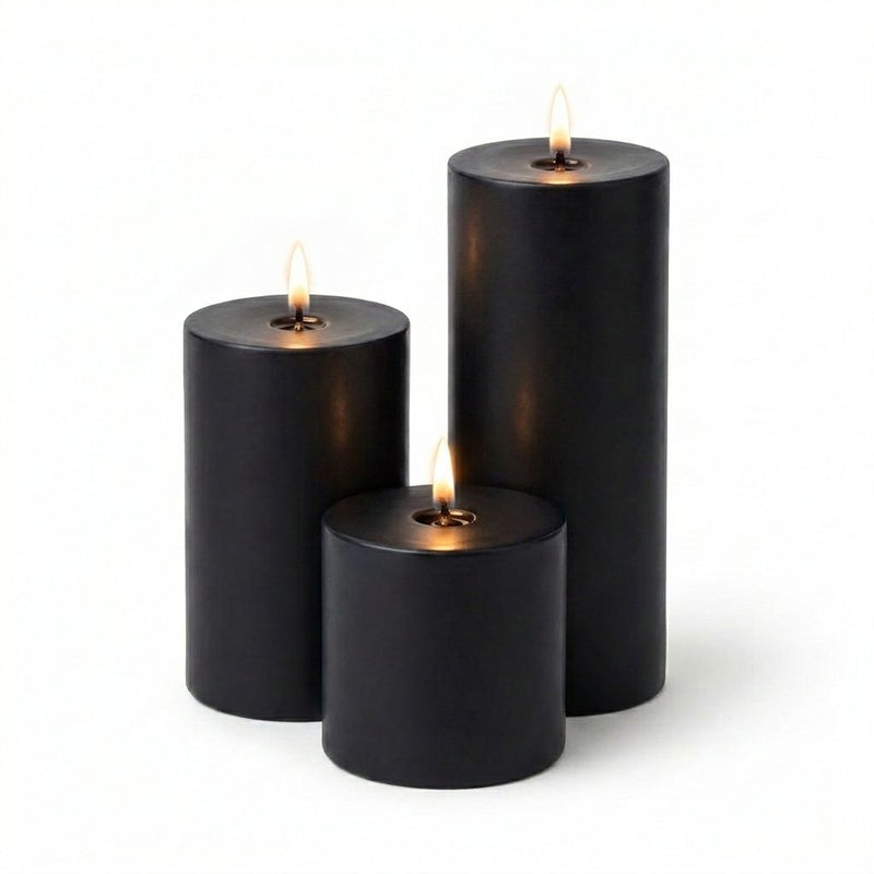 Three black candles of different sizes on a white background - thumbnail number 2