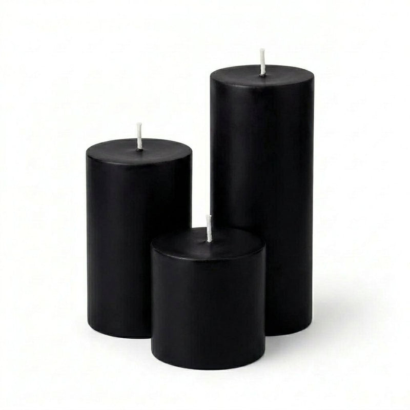 Three black candles of different sizes on a white background - thumbnail number 1