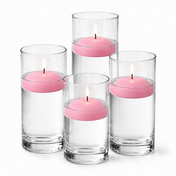 Four glass cylinders filled with water hold lit pink floating candles - thumbnail number 1