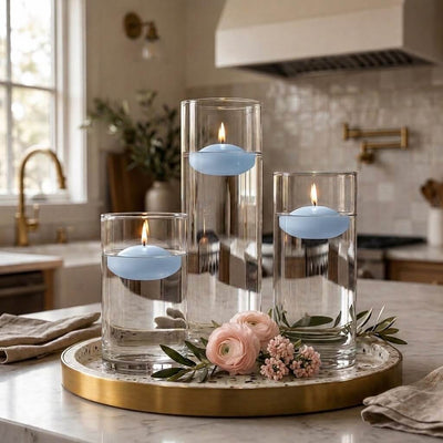 Three glass cylinder vases with lit light blue floating candles and pink flowers on a tray - thumbnail number 7