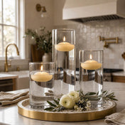 Three lit ivory floating candles in cylinder vases on a brass-rimmed tray - thumbnail number 7