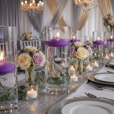 Glass cylinder vases with lit purple floating candles and roses - thumbnail number 5