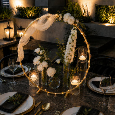 Gold hoop wedding centerpiece with white flowers and fairy lights on a table - thumbnail number 3