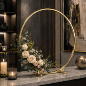 Gold hoop centerpiece with flowers and eucalyptus on a marble counter - thumbnail number 8