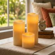 Assorted glowing LED candles displayed on a side table near a window - thumbnail number 6