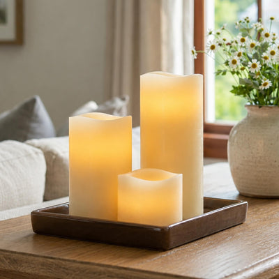 Flameless LED wavy-top pillar candles glowing on a wooden tray indoors - thumbnail number 7