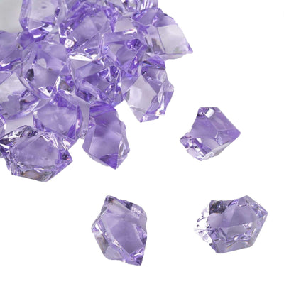 A cluster of large, faceted lavender acrylic ice bead vase fillers on a white background. - thumbnail number 1