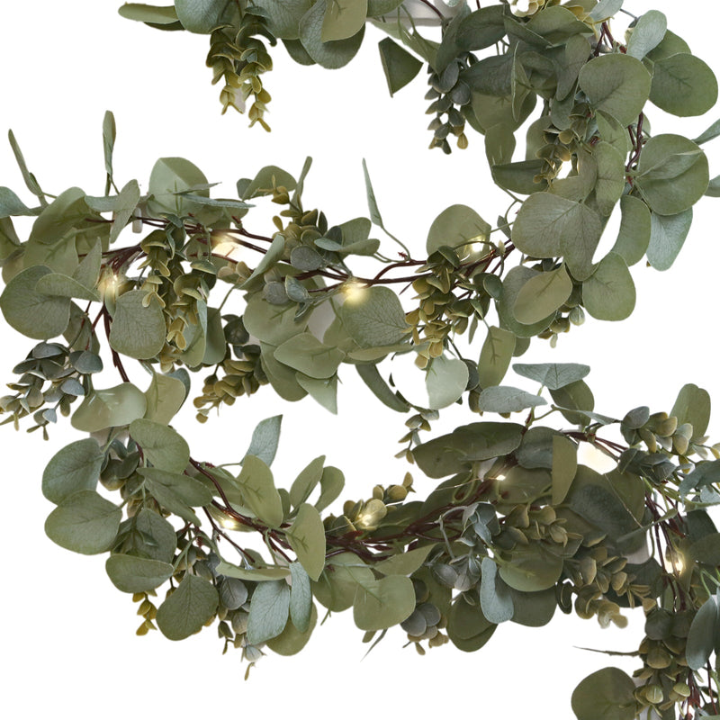 Faux greenery eucalyptus garland with warm LED lights on a white background - thumbnail number 1