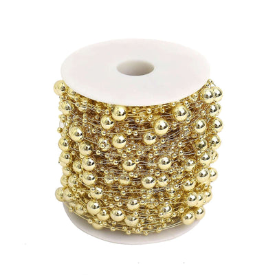 Gold faux pearl bead string vase filler spool on white background - thumbnail number 1