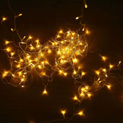 Warm white string lights glowing on dark background - thumbnail number 1
