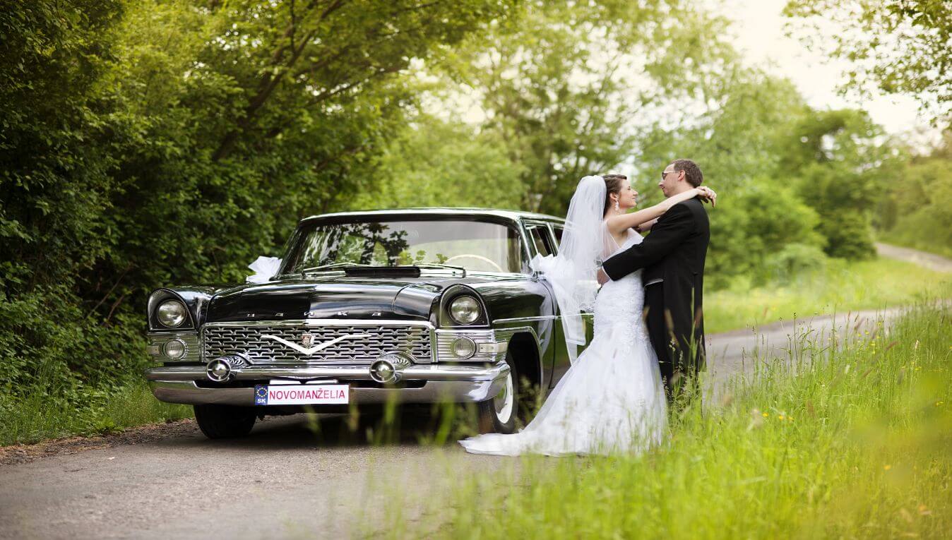 couple next to vintage car
