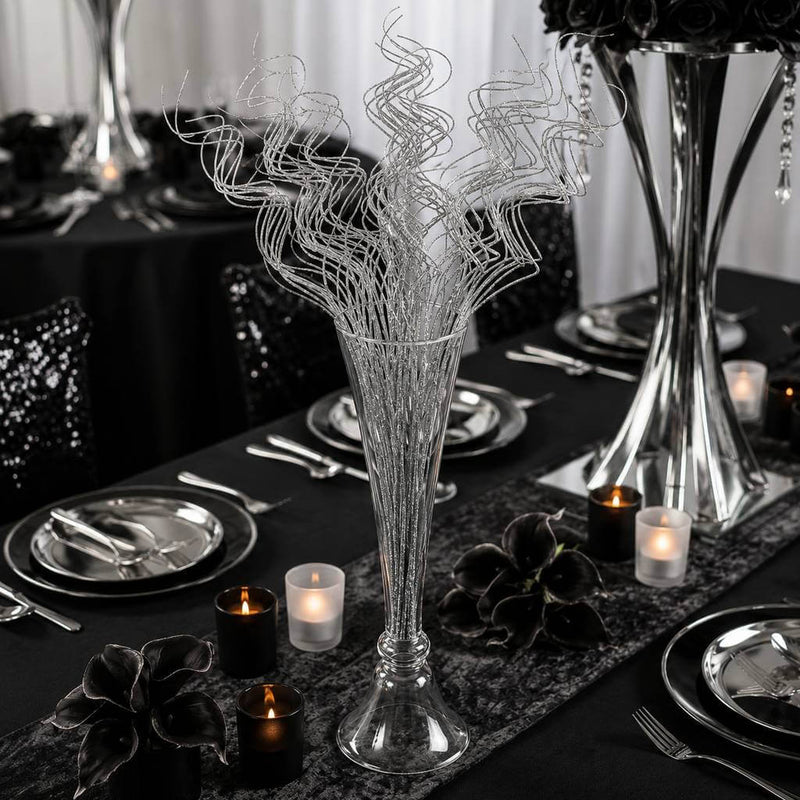 Silver sparkle curly ting stems in a glass vase on a formal black table setting - thumbnail number 7