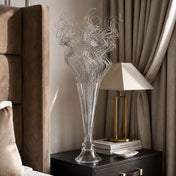 Silver sparkle curly ting stems in a glass vase on a nightstand - thumbnail number 11