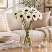 15" White Anemone Flower bouquet in a glass vase on a coffee table with books and candle - thumbnail number 7