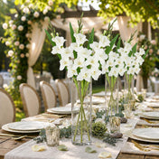 White gladiolus flower sprays in glass cylinder vases on a long outdoor wedding dining table - thumbnail number 4