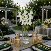 Cream white gladiolus flower spray in a glass vase on an outdoor table setup - thumbnail number 6