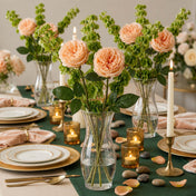 Long stem peach roses in a clear glass vase on a beautifully decorated dining table with candles - thumbnail number 3