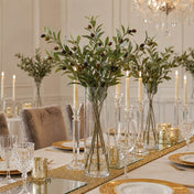 A tall glass vase of 31.5" olive branches on a table - thumbnail number 5