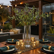 A tall glass vase of 31.5" olive branches on an outdoor table - thumbnail number 6