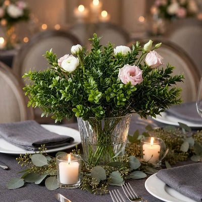 Green boxwood sprays with pink and white flowers in a glass vase - thumbnail number 4