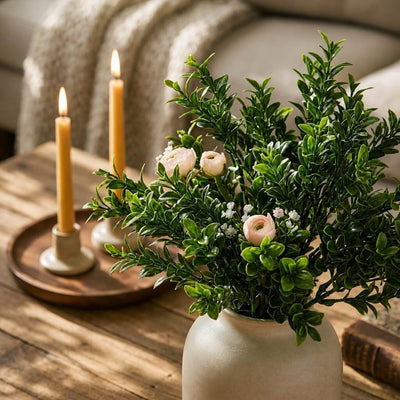 Green boxwood sprays with pink flowers in a ceramic vase with lit candles - thumbnail number 7