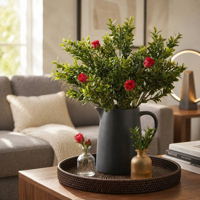 Green boxwood sprays with red roses in a black pitcher on a tray - thumbnail number 8
