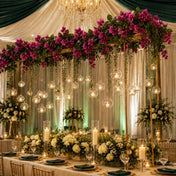 Bougainvillea garland suspended over a wedding table with hanging candles - thumbnail number 5