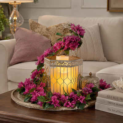 Bougainvillea garland wrapped around a lit candle cage on a tray - thumbnail number 8