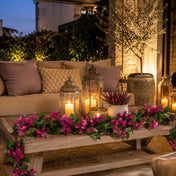 Bougainvillea garland and lanterns on a coffee table on a patio - thumbnail number 9