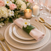 Banana leaf napkin ring with a white flower on pink napkin - thumbnail number 5