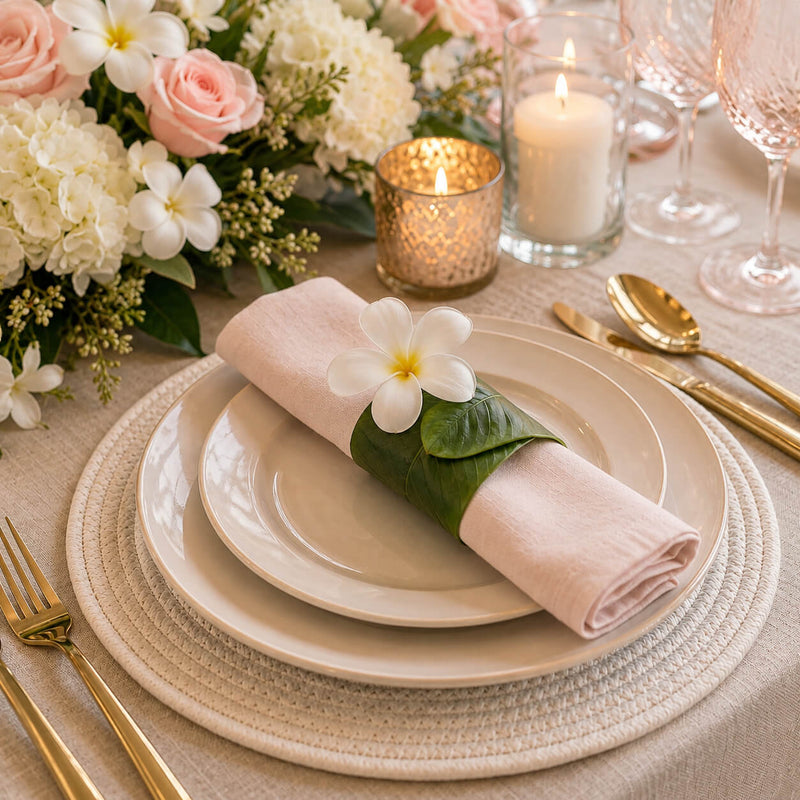 Banana leaf napkin ring with a white flower on pink napkin - thumbnail number 5