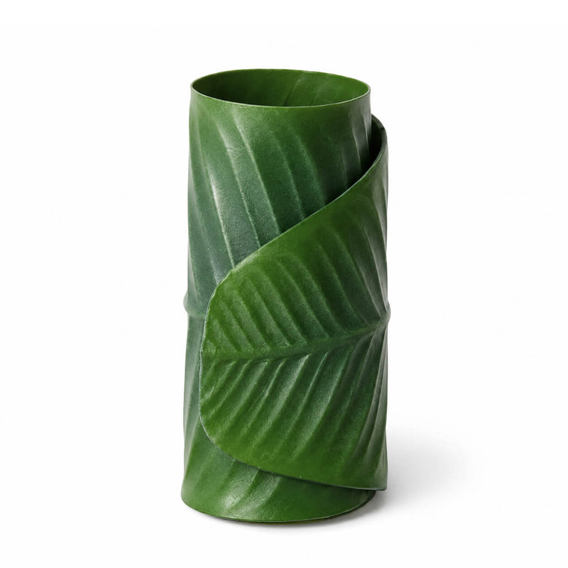 Close-up of a single green banana leaf napkin ring isolated on white background - thumbnail number 1