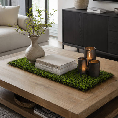 Faux moss leaf and twig mat styled on a coffee table with books and candles - thumbnail number 7