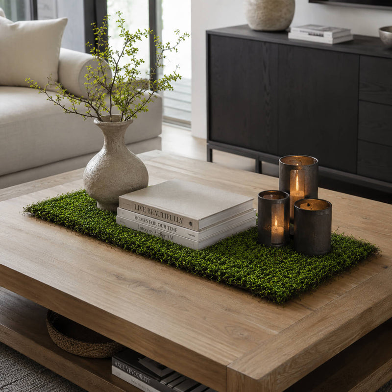 Faux moss leaf and twig mat styled on a coffee table with books and candles - thumbnail number 7