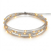 A coiled strand of glowing warm white battery-operated LED fairy lights on a white background - thumbnail number 1
